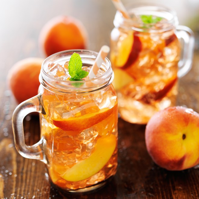 jar of peach tea with striped straw